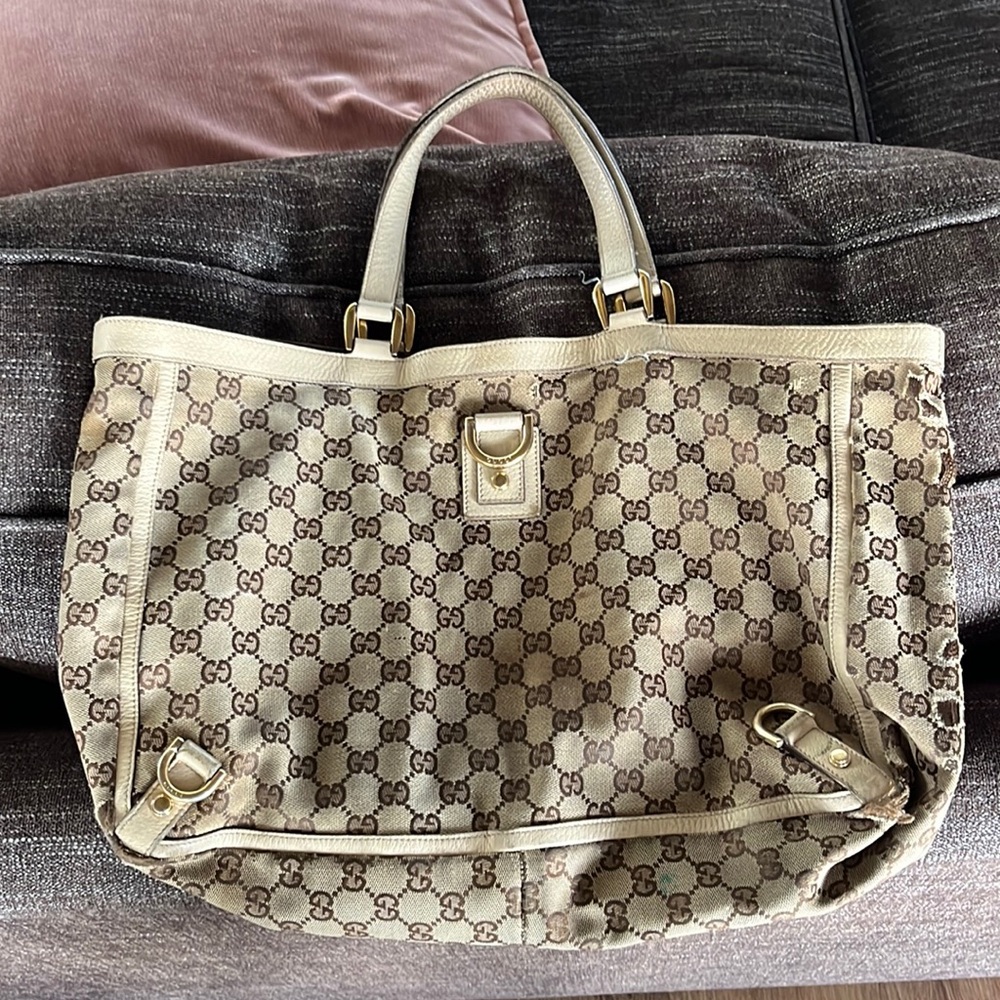Authentic vintage Gucci bag. There is a lot of wear and tear.